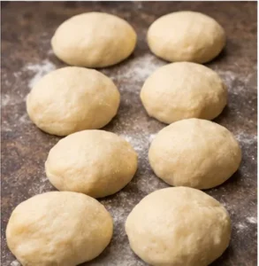 8 Coco dough shaped, ready to be baked