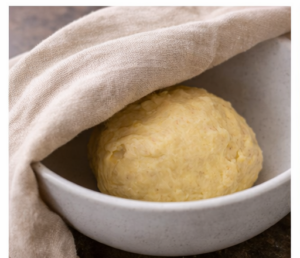 Dough resting in a bowl
